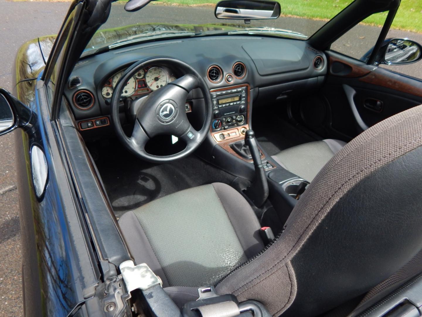 2002 Black /Black Cloth Mazda MX-5 Miata base (JM1NB353920) with an 1.8 liter 4 cylinder engine, 5 speed manual transmission, located at 6528 Lower York Road, New Hope, PA, 18938, (215) 862-9555, 40.358707, -74.977882 - Here for sale is a very fun 2002 Mazda MX-5 Miata. Under the hood is a strong running 1.8 liter 4 cylinder which puts power to the rear wheels via a solid shifting 5 speed manual transmission. Features include; Black cloth interior, wood grain trim, cold AC, power windows, AM/FM/CD, heated rear wi - Photo#24